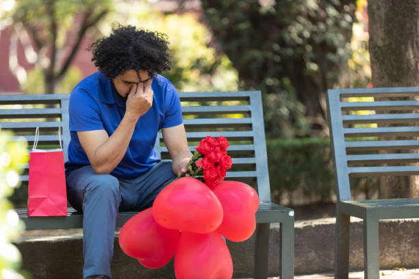 istock mexican man sitting on park bench crying on valentine day, bad date 1461217669