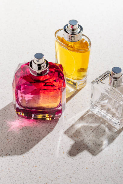 istock A group of perfume bottles on a white stone background on a sunny day 1461218746