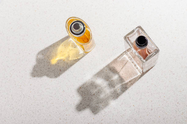 istock A group of perfume bottles on a white stone background on a sunny day 1461218760