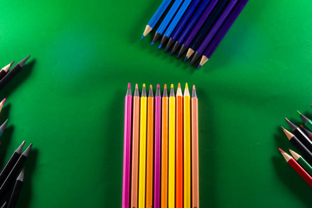 istock Color pencils on green background. stacked side by side. 1461219186