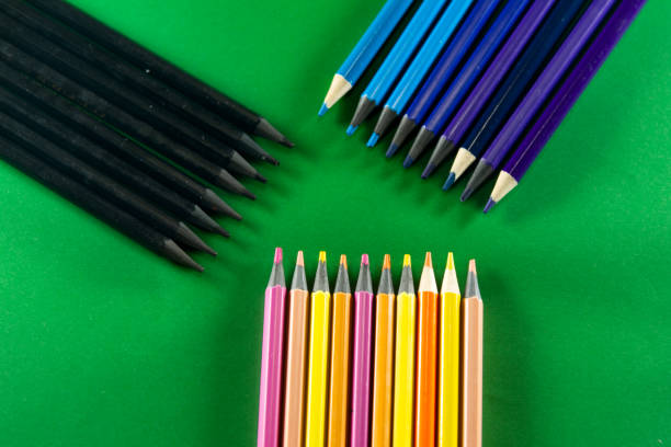 istock Color pencils on green background. stacked side by side. 1461219219