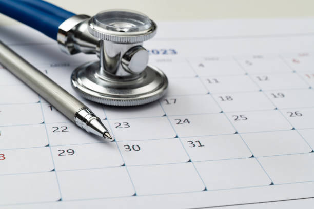 istock Stethoscope and pen on a calendar 1461220891