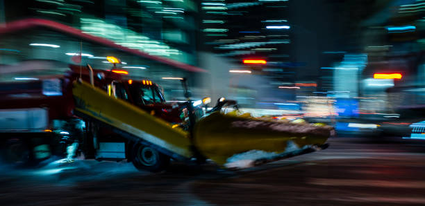 SNOWPLOW IN MOTION BLUR Blurred motion;  Snowplough in the move at Toronto slippery unrecognizable person safety outdoors stock pictures, royalty-free photos & images