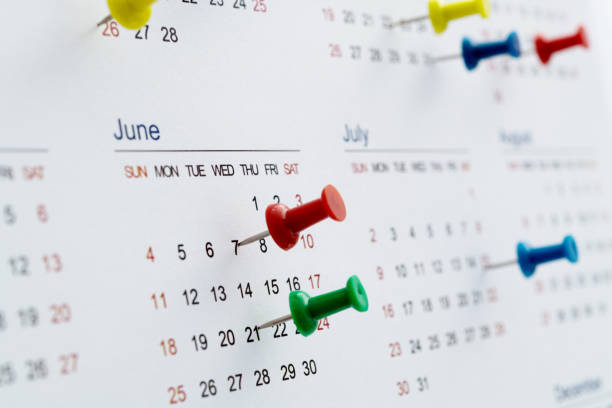 istock Thumbtack pins on a calendar 1461221038
