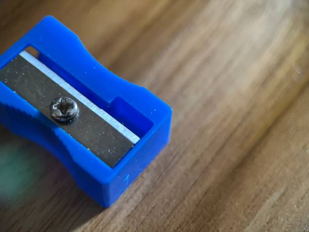 istock Blue pencil sharpener on wooden background 1461221167