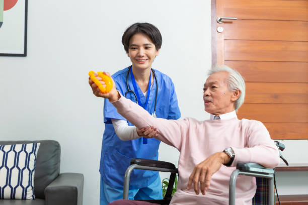 istock Hands of senior man or patient doing exercise with rubber squeezing a stress yellow ball for loosen the muscles and The blood flow better. health concept 1461222306