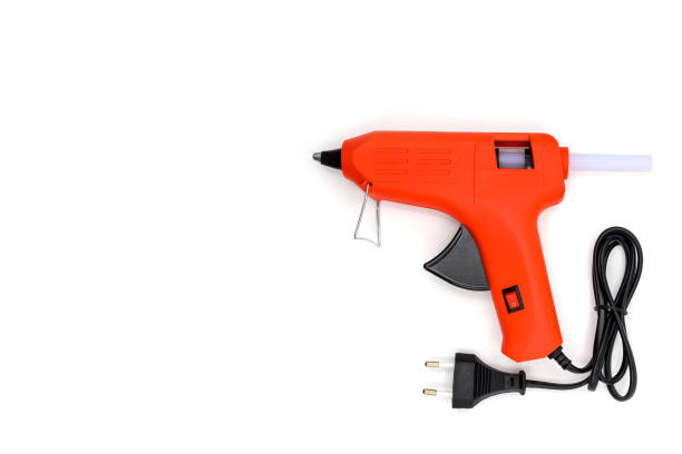 istock red glue gun close-up on a white background 1461224452