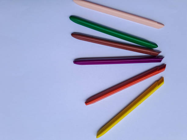 istock Multicolored Crayons and pastels lying in chaos isolated on white background with copy space. 1461224501