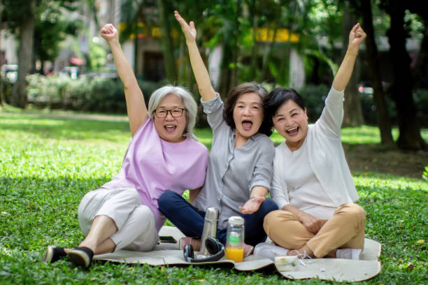 istock Three senior women gathering in the park 1461229804