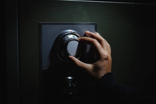 Turning a password on dial for open the safe box. Keep money and valuables in the vintage safe box steel. Stealing or keeping money and valuables safe.
