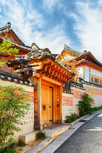 Scenic traditional Korean houses of Bukchon Hanok Village in Seoul, South Korea. Beautiful cityscape on sunny day. Seoul is a popular tourist destination of Asia.