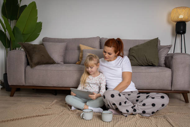 istock Mother and daughter using a digital tablet together 1461245872
