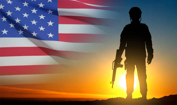 istock Silhouette of soldier with USA flag 1461248792