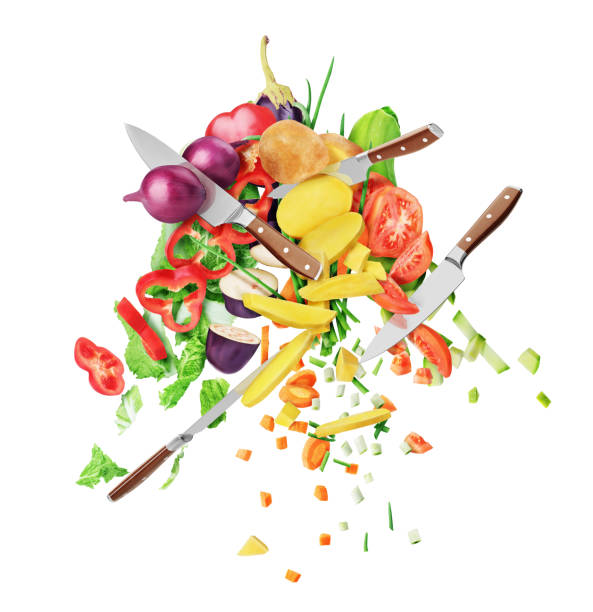 istock Kitchen knives are flying through and cutting vegetables on a white background. Healthy nutrition 1461250701