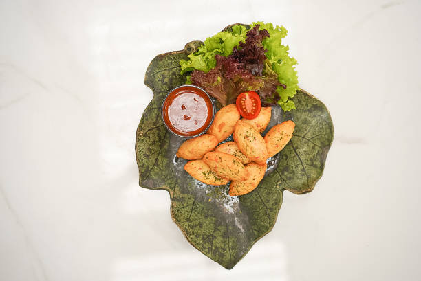 istock Snacks ini a green plate with sauce and lettuce 1461253113