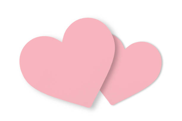 istock Pink paper cut heart shape isolated on white background for Valentine's Day celebration. 1461253673