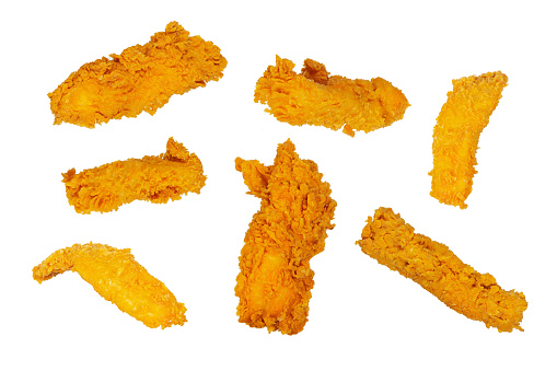 Golden fried chicken strips in different angles isolated on a white background.
