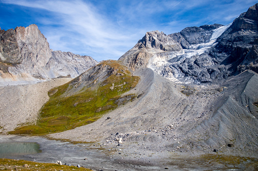 Long lake and Grande Casse Alpine glacier landscape in French alps