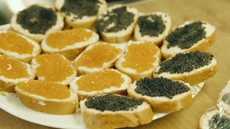 Sandwiches with black and red caviar.