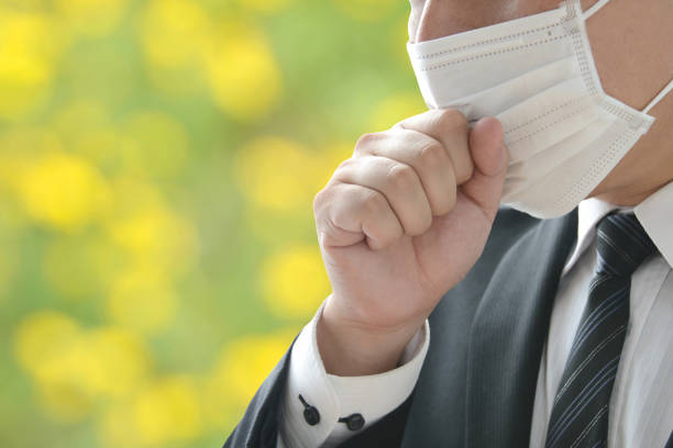 business man suffering from hay fever - hay fever imagens e fotografias de stock