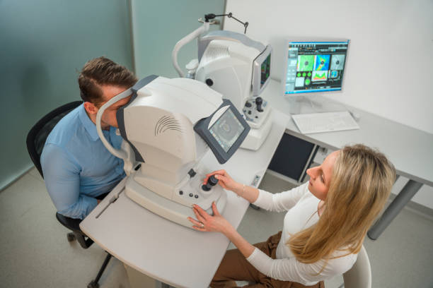 istock High Angle View of Ophthalmologist Checking Patient's Eyes 1461268372