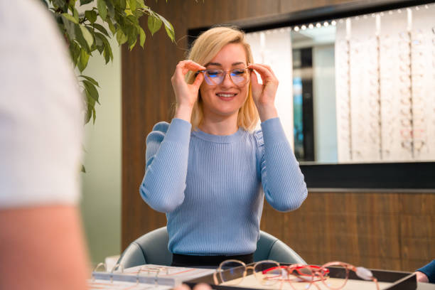 istock Close up of Excited Female Using and Comparing Glasses Frames 1461268627