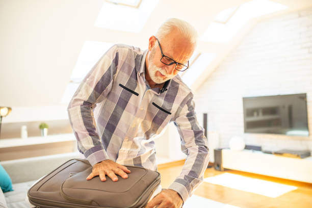 istock An elderly man is preparing for a trip 1461269440