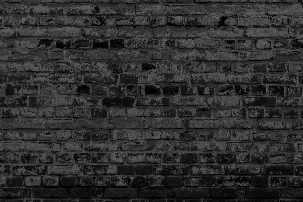 Old black brick wall. stock photo