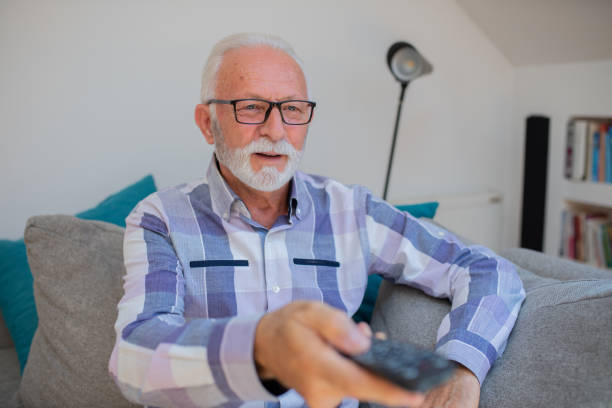 istock Man watching TV in the room 1461270276