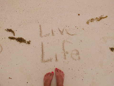 The beach sand is a canvas for everyone. It's written by you. Live Life and Love yourself!