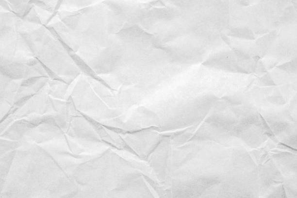 istock Abstract white crumpled and creased recycle paper texture background 1461273235