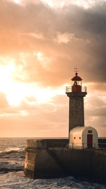 istock Farolim de Felgueiras against the vivid sunset sky 1461274664