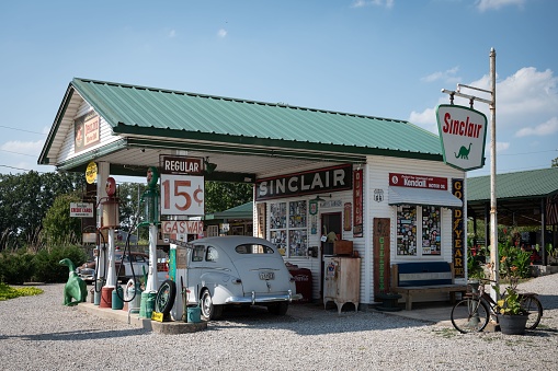 Seligman, Arizona, United States - September 22, 2023: Old vintage cars parked near a gift shop in Seligman with other Route 66 items