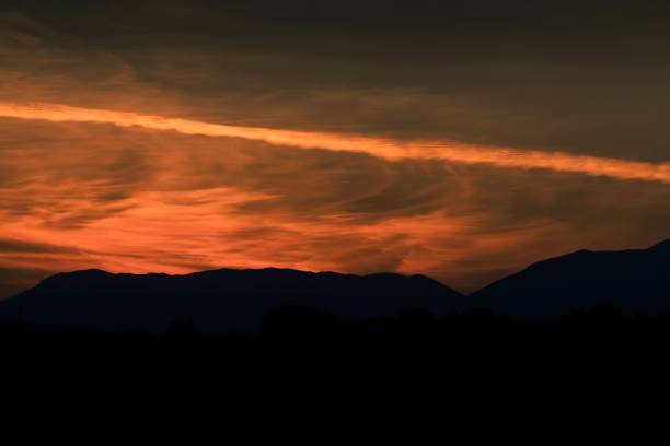 istock Golden sunset over the trees and mountains 1461277285