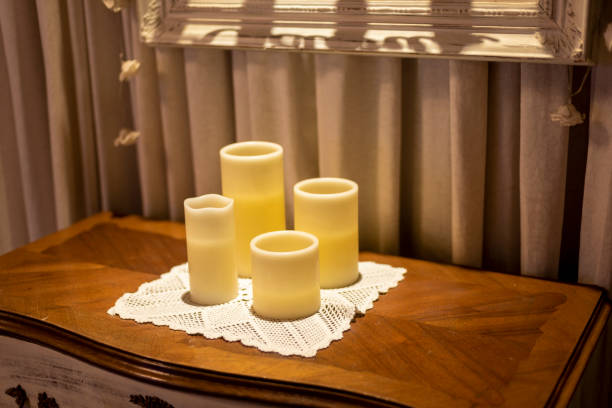 istock Beautiful beige Candles Caravan on a wooden table 1461278336