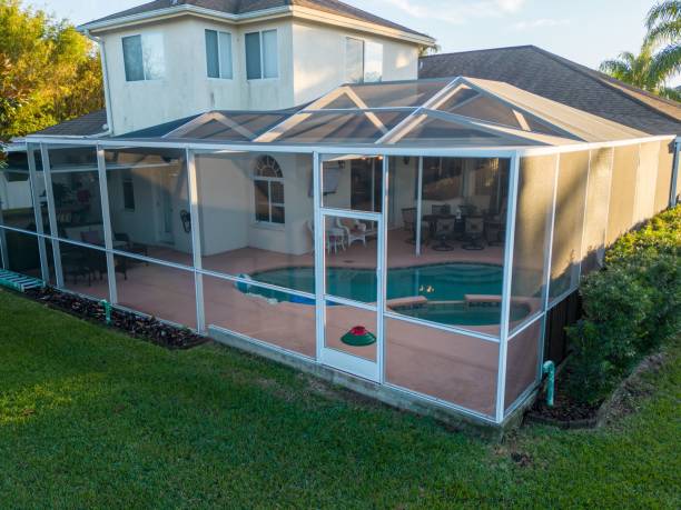 istock Aerial view of pool screen enclosure surrounded by trees 1461280566
