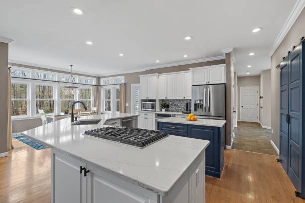 istock Closeup shot of a modern kitchen with white and dark blue interior design 1461286237