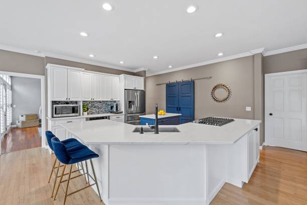 istock Closeup shot of a modern kitchen with white and dark blue interior design 1461286245