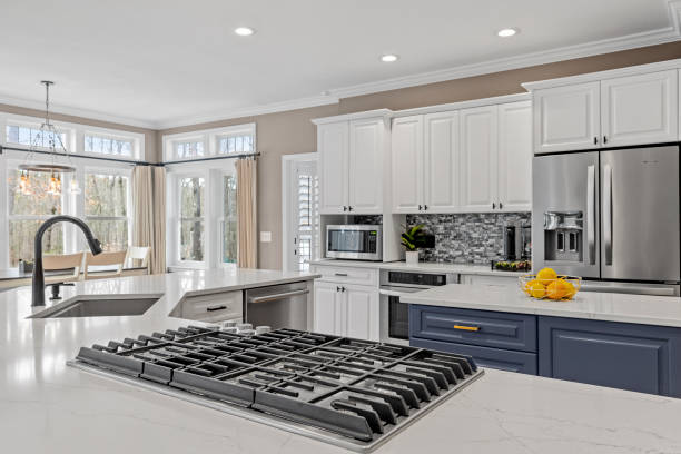 istock Closeup shot of a modern kitchen with white and dark blue interior design 1461286248