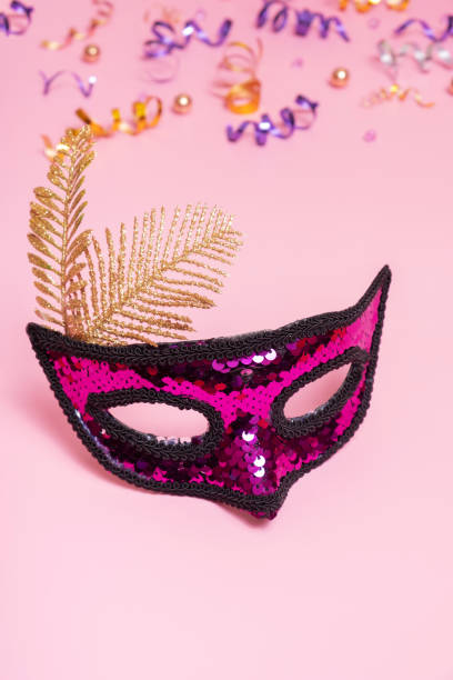istock Festive face mask for carnival celebration or masquerade on colored background 1461287649