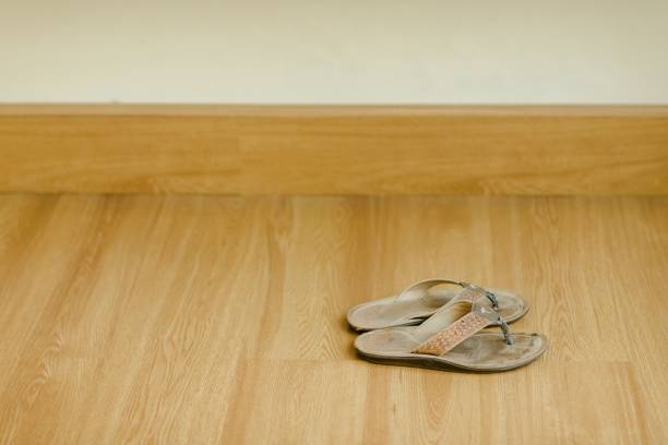 istock Pair of slippers on the floor 1461287754