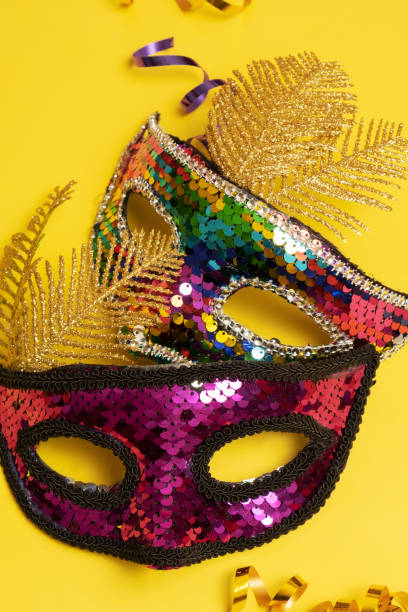 istock Festive face mask for carnival celebration or masquerade on colored background 1461287772