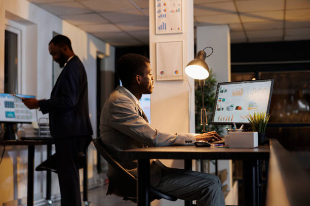 istock African american businessman looking at financial graphs 1461289342