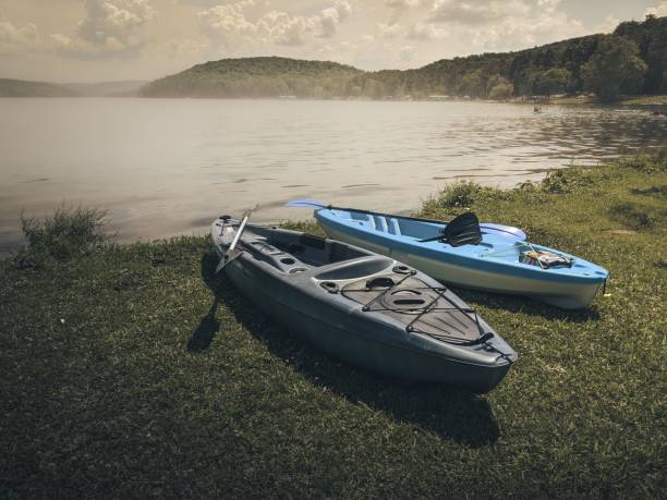 istock Boats on the shore with a river in the background on a cloudy day 1461291232