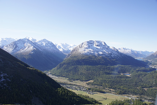 A scenic view of the mountains and the valley in Muottas Muragl, Samedan, Switzerland
