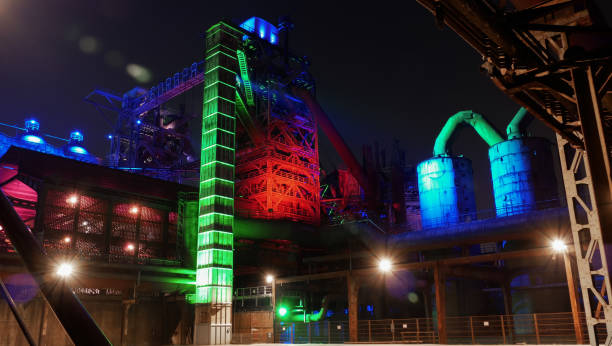 istock Illuminated steel factory with a crane in Germany 1461292076