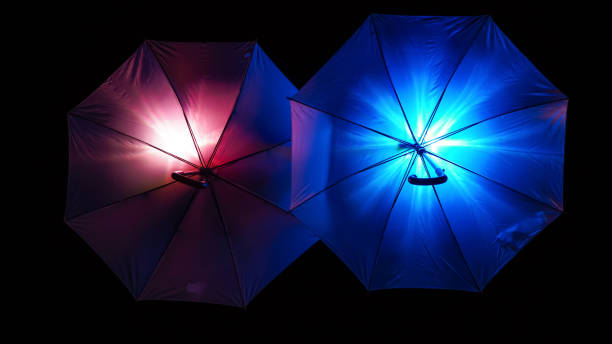 istock Colorful illuminated umbrellas isolated on a dark background 1461292083