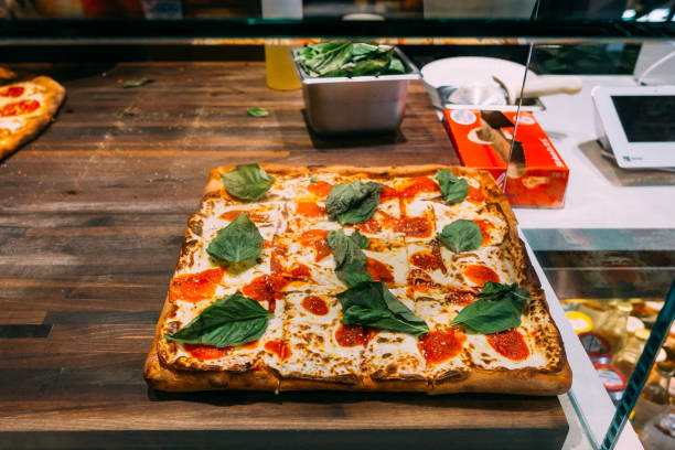 istock Selective focus shot of a fresh delicious mozzarella cheese pizza with basil 1461292916