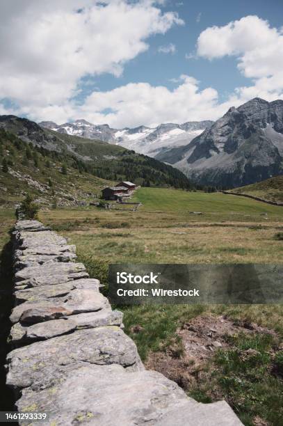 Vertical Shot Of The Beautiful Fields And Mountains In Rieserfernerahrn Nature Park Ital Stock Photo - Download Image Now