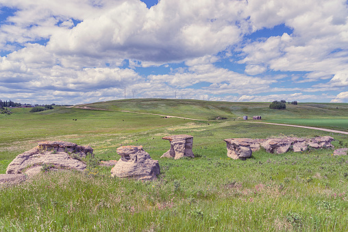 Landscape of rock formations on the Alberta Prairie, cloudy sky, Canada